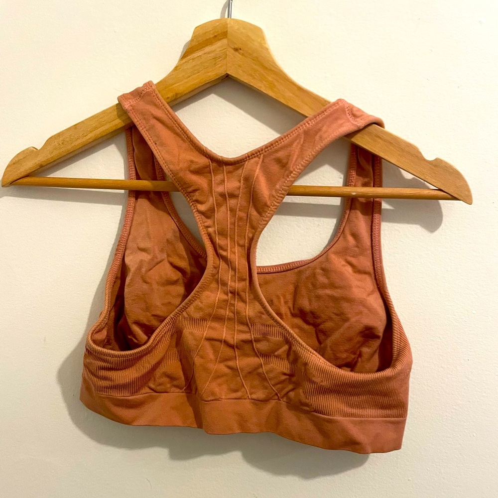Champion salmon colored sports bra. Size L